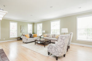 A warm and comforting living area with an area rug and how to sell your property