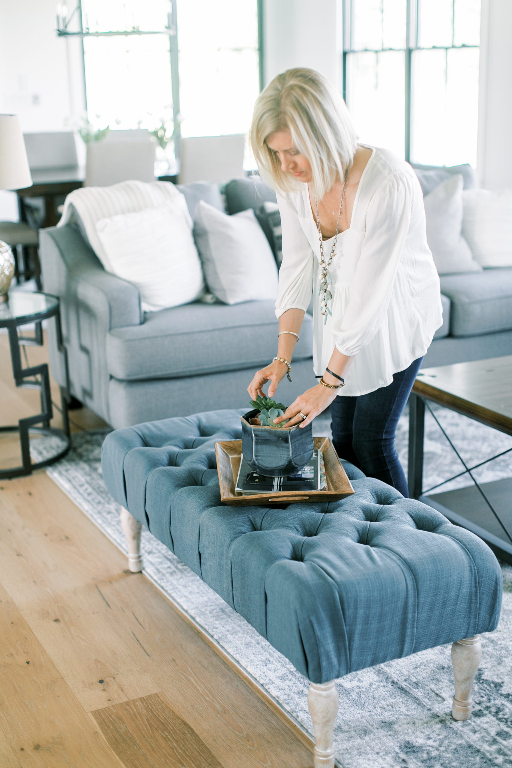Owner Whitney Vredenburgh styling a living room